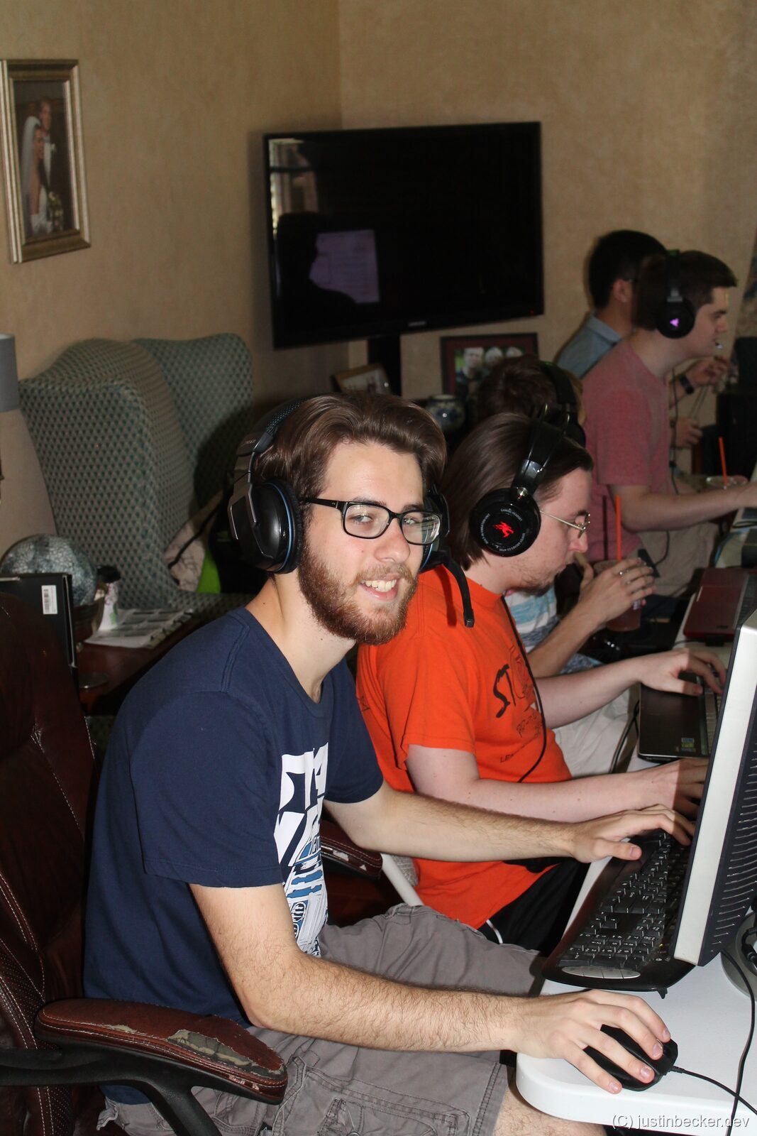 A gamer at a LAN party with poor posture