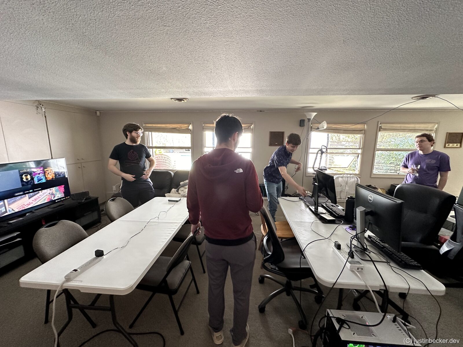 LAN party space being set up with tables and chairs before guests arrive