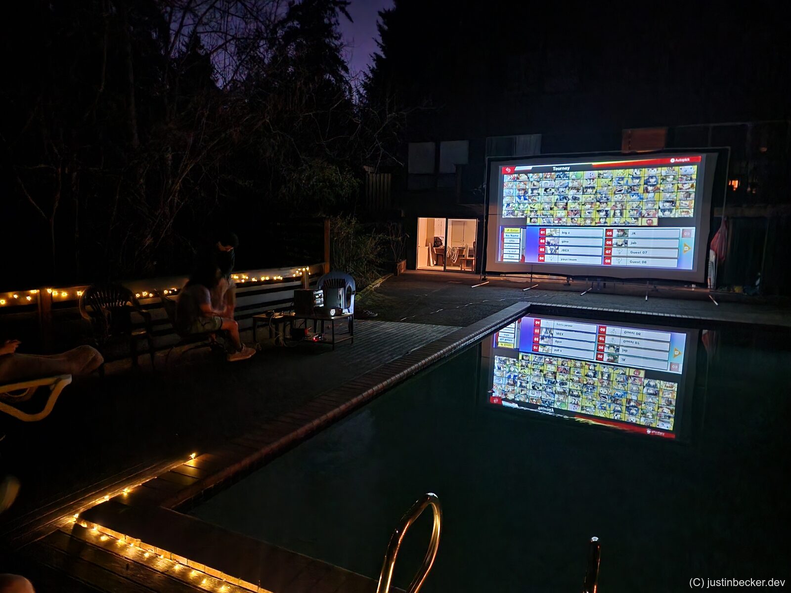 Super Smash Bros. tournament bracket displayed on a projector at a LAN party